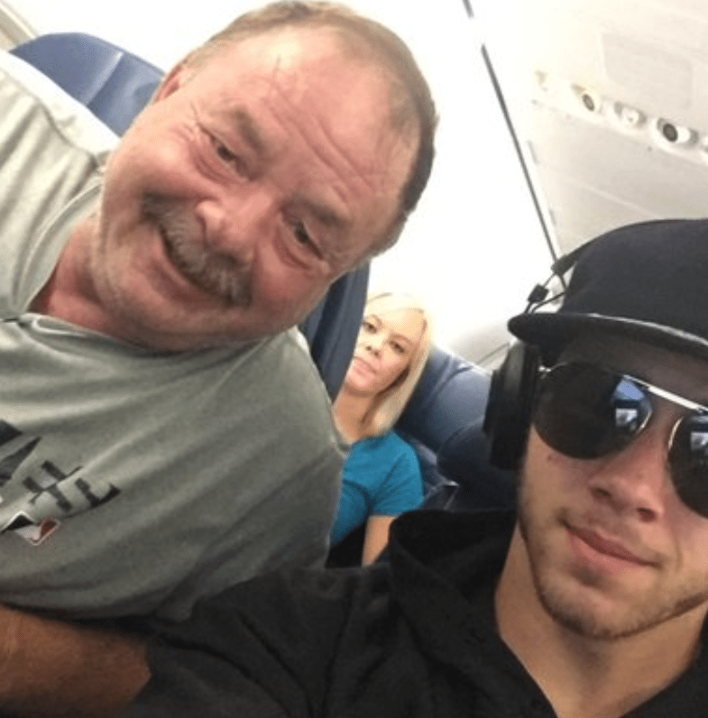 Dad Realizes He’s Sitting Next To Nick Jonas & Takes Selfie That Leaves Daughter Swooning