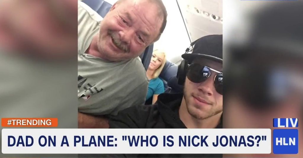Dad Realizes He’s Sitting Next To Nick Jonas & Takes Selfie That Leaves Daughter Swooning