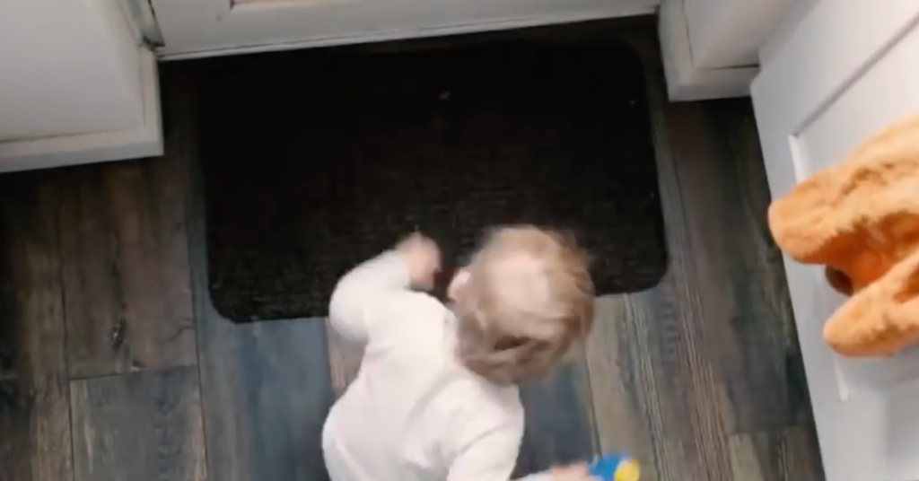 Watch how this toddler puts away his toys