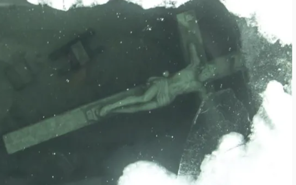 Divers are trying to recover an ‘arm’ of rare underwater crucifix of Jesus in Michigan